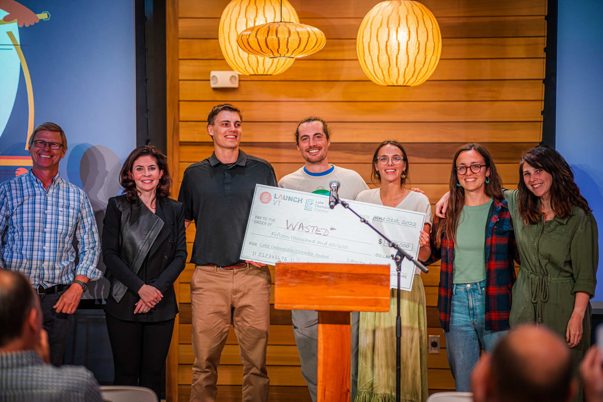 Group of people posing with a large check for $15,000 from Launch VT.