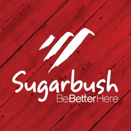 Logo of Sugarbush Resort featuring the phrase "BeBetterHere" on a red wooden background.