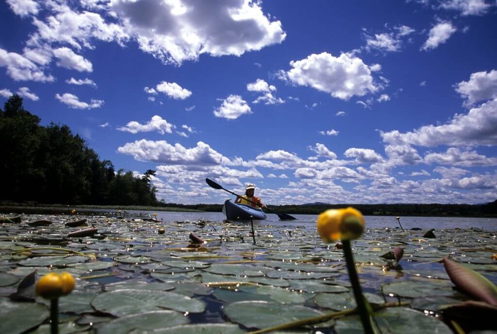 Person kayaking on Lake Champlain