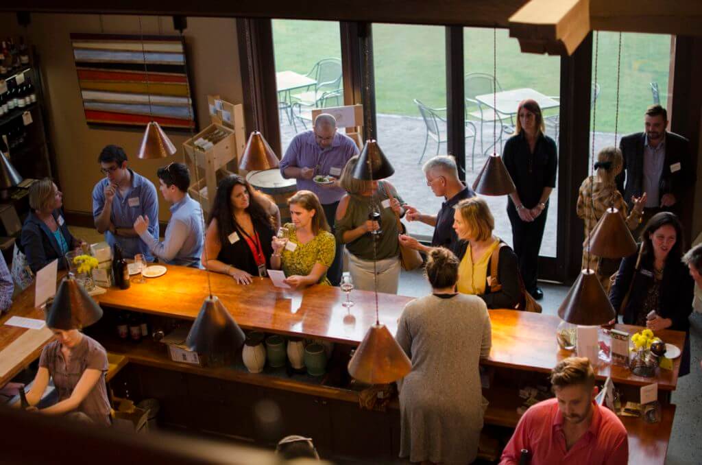 Group of people enjoying wine at Shelburne Vineyard