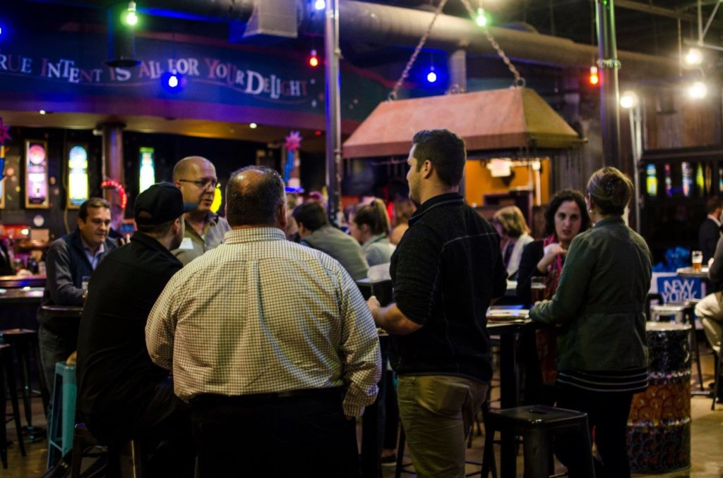 people talking/networking at Magic Hat brewery