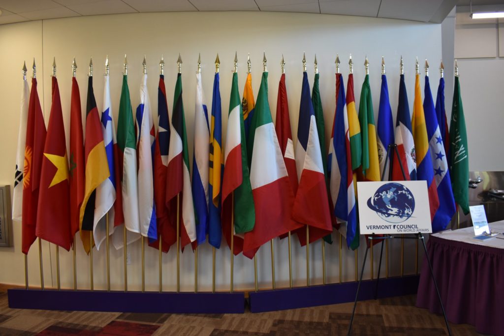 a photo of international flags and the VCWA logo at last year's annual dinner