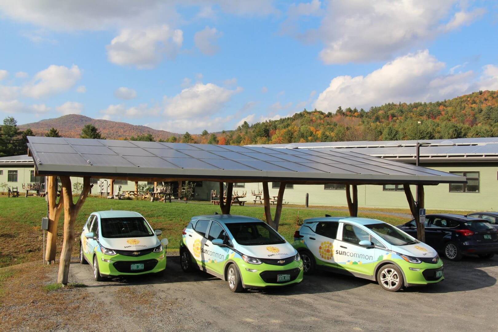 photo of suncommon fleet of cars under solar paneled car ports