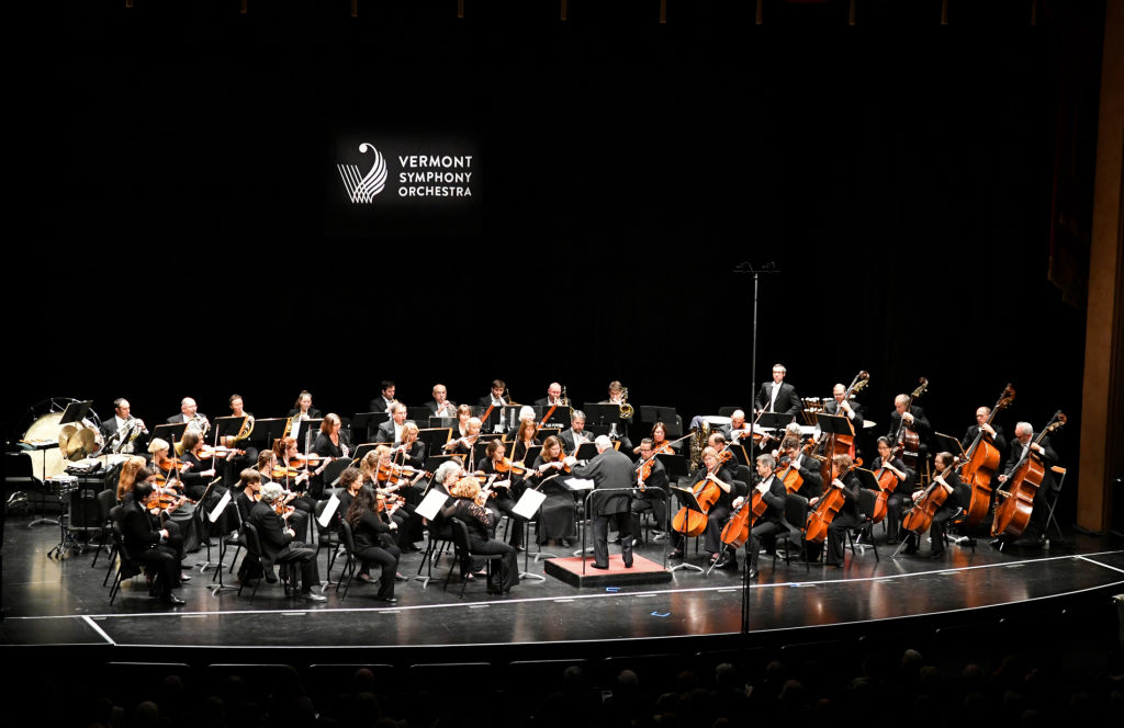 photo of entire vermont symphony orchestra ensemble playing on stage