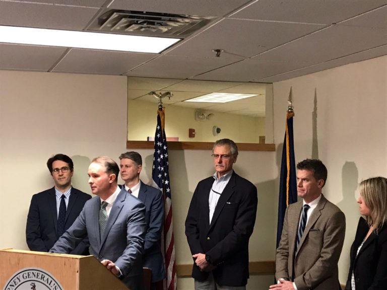 photo of Attorney General TJ Donovan giving a press conference with Chamber President Tom Torti standing behind him