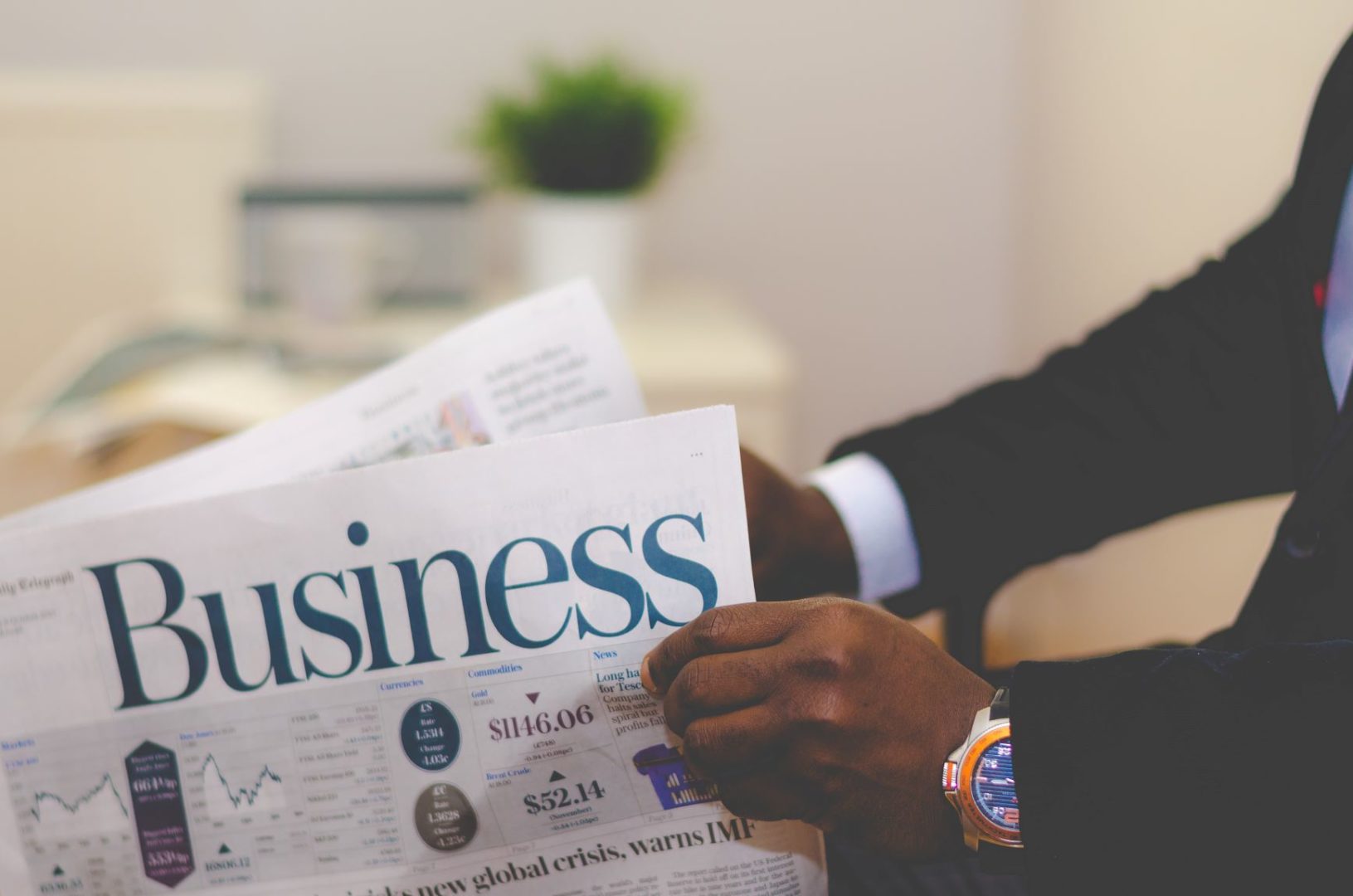 man holding a newspaper