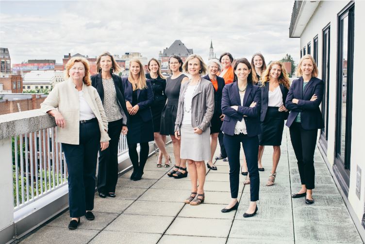 drm law firm women pose on balcony
